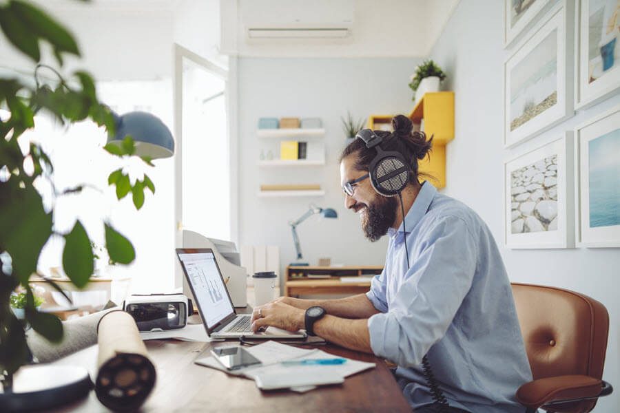 man using laptop at desk