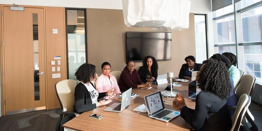 business leaders making informed decisions around a conference room table