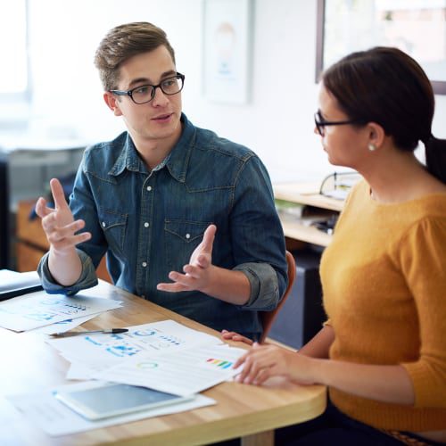 man and woman talking about managed microsoft services