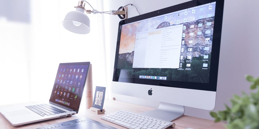 laptop next to a monitor