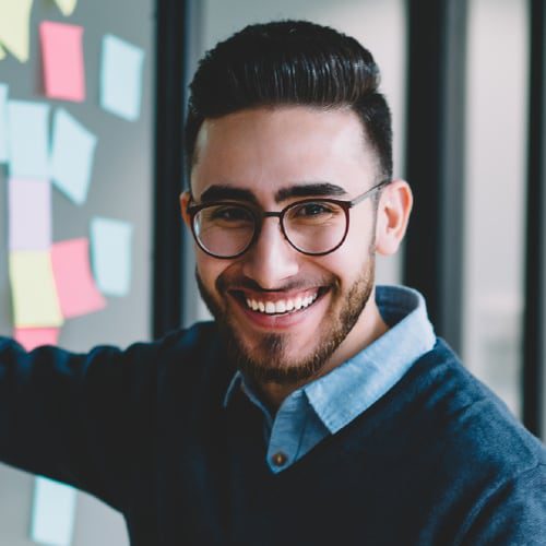 man in glasses smiling