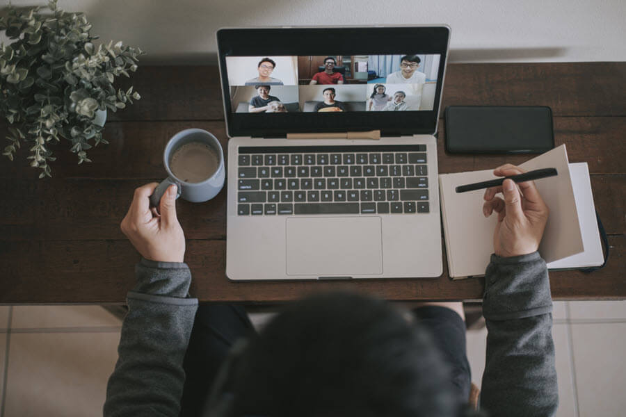 man on video conference on laptop