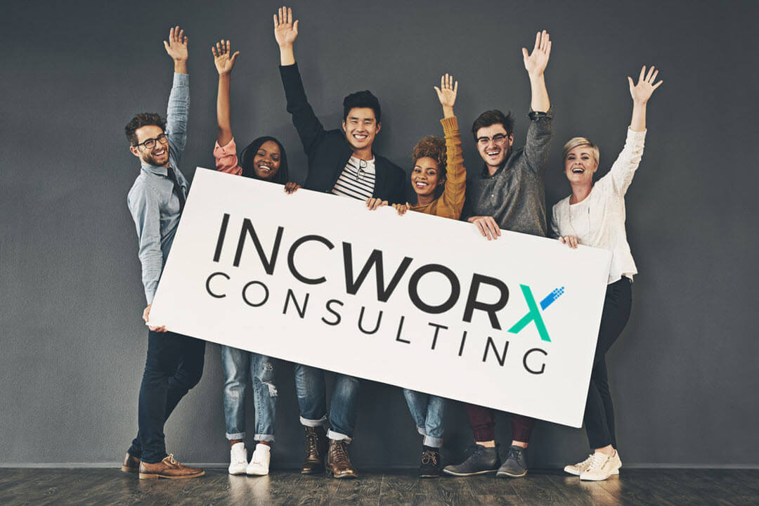 IncWorx team holding a sign with logo