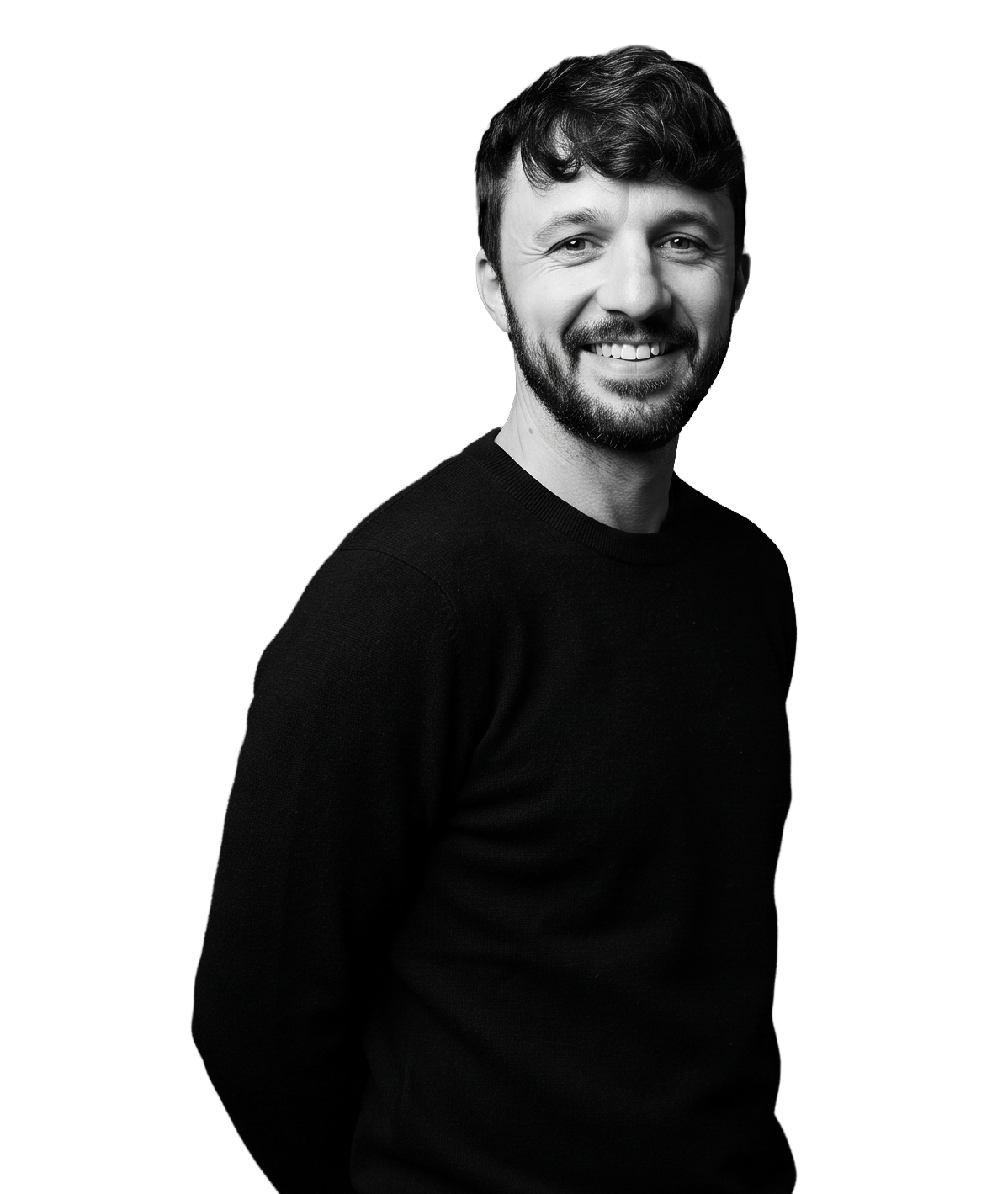 IncWorx Microsoft Consultant, Joseph, smiling in black sweater, hands in pockets.