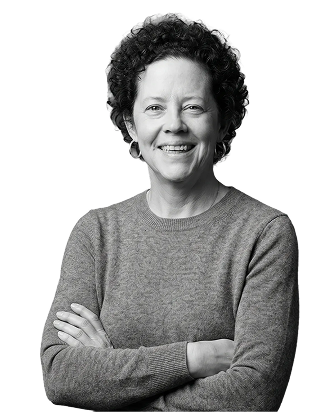 IncWorx consultant, Robyn, smiling with her arms crossed in a grey long sleeved shirt.