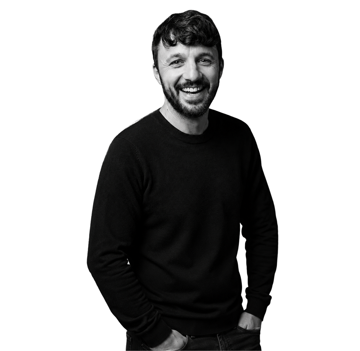 IncWorx consultant, Joseph, smiling in black sweater, hands in pockets